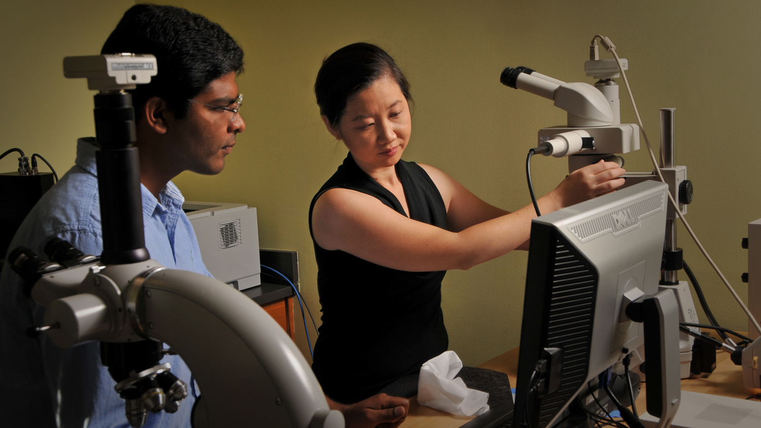 faculty working in textiles lab